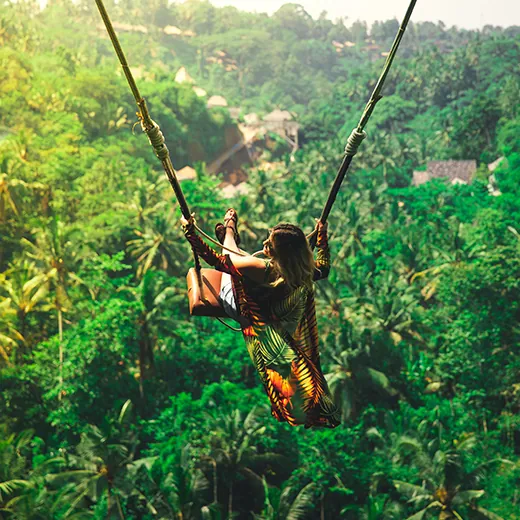 a girl on bali swing