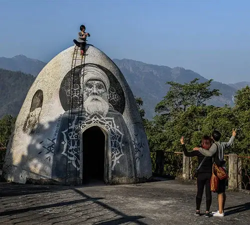 tourists clicking pictures at beatles ashram