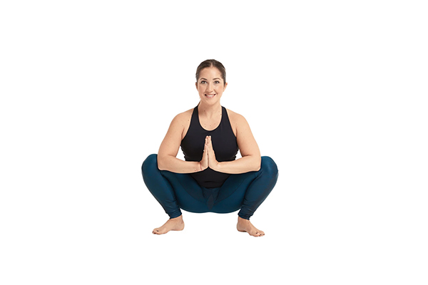 woman performing malasana