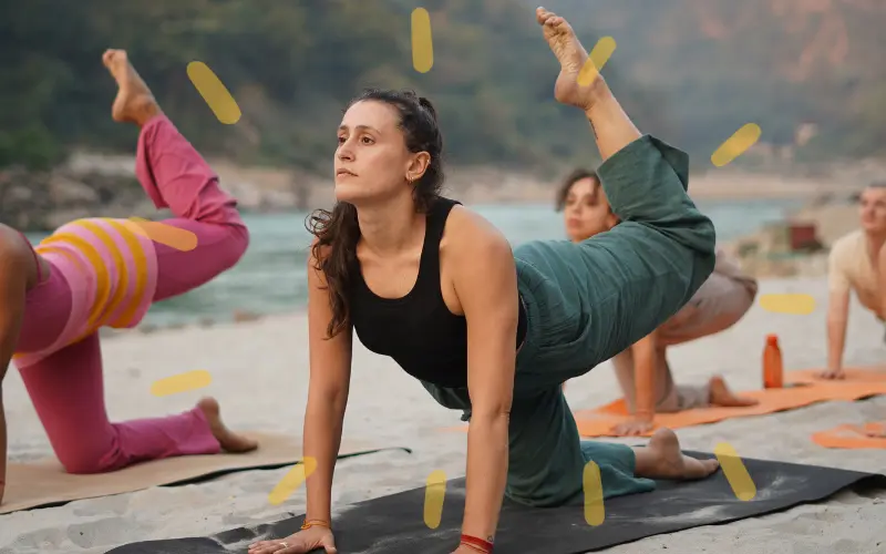 Students practicing Surya Namaskar at a yoga school in Rishikesh